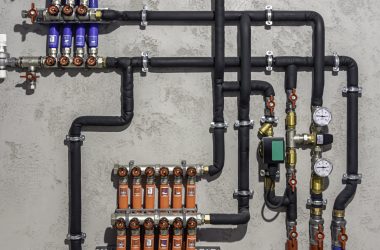A modern electric boiler room. Equipment for modern heating system as a boiler, heater,pipes, expansion tank and other.
